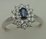 10 Karat White Gold Diamond Ring With Flower Shaped Blue Sapphire Stone